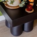 black concrete patio side table curved design